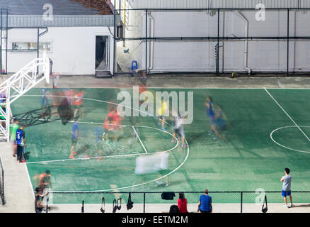 Movement of basketball player in the urban field at night. Stock Photo