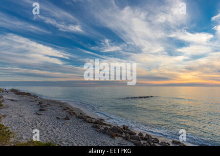 Fine white wispy clouds in sky at sunset over Gulf of Mexico at Caspersen Beach in Venice Florida Stock Photo