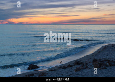 Fine white wispy clouds in sky at sunset over Gulf of Mexico at Caspersen Beach in Venice Florida Stock Photo