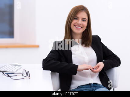 Beaming Smiling Woman Spending Time In Strange Posture Stock Photo