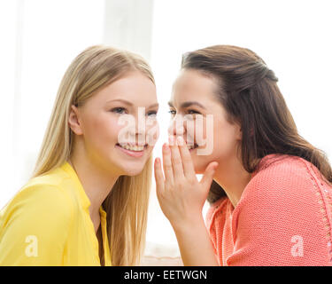 one girl telling another secret Stock Photo