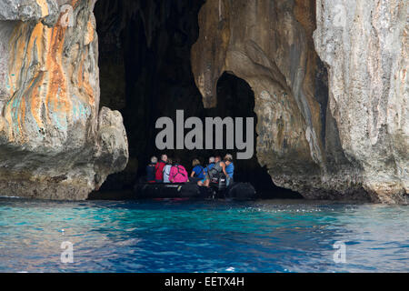 Kingdom of Tonga, Vava'u Islands, Swallow's Cave near Neiafu. Tourists in zodiac exploring cave. Stock Photo