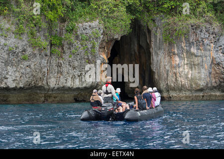 Kingdom of Tonga, Vava'u Islands, Swallow's Cave near Neiafu. Tourists in zodiac exploring cave. Stock Photo