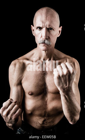 Old man in boxing pose Stock Photo