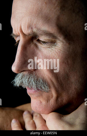 Old Bald Man in profile close-up Stock Photo