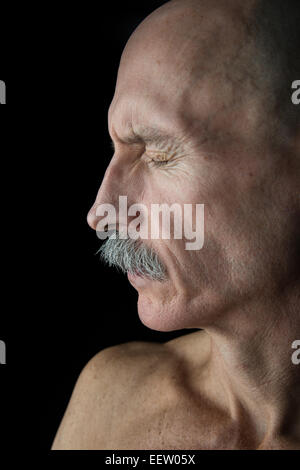 Old Bald Man in profile Stock Photo