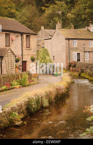 English county cottages and a stream in Castleton, High Peak, Derbyshire. Stock Photo