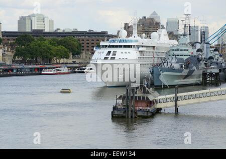 Cruiser ship moored alongside the HMS Belfast in London, England Stock Photo