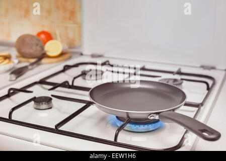 empty pan on the stove burning flame Stock Photo