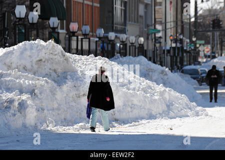 New Haven--People walk along Church Street in front of City Hall past huge snow piles. Stock Photo