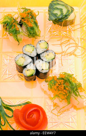 Avocado sushi and whitefish nigiri on platter Stock Photo