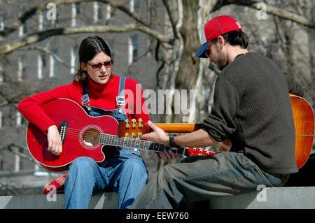 New York City:  Two musicians strumming their guitars on the wall in front of Grant's Tomb in Riverside Park Stock Photo