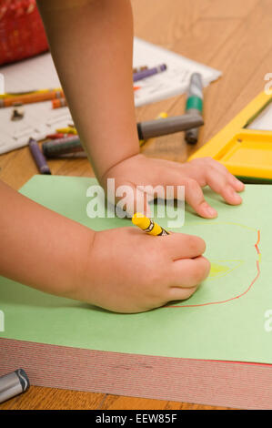 Young boy drawing a picture Stock Photo