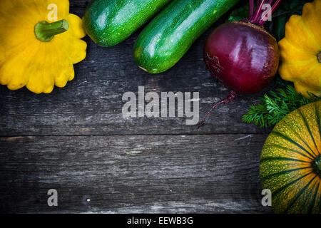 Fresh organic seasonal vegetables - pumpkin, squash, beetroot on wooden background Stock Photo