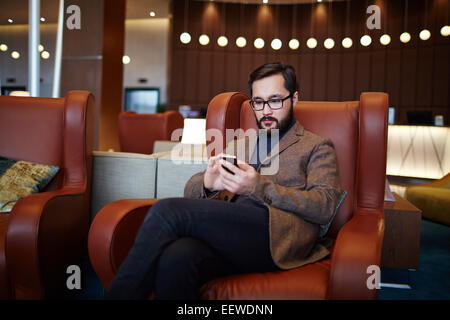 Asian businessman using cellphone Stock Photo