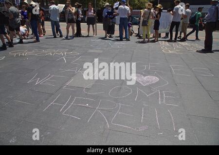 Sydney, Australia. 21st January, 2015. Refugee activists held rallies across Australia including one outside the Department of Immigration and Citizenship at 26 Lee Street, Sydney, organised by Refugee Action Coalition (RAC). The rallies were held in solidarity with the Manus Island hunger strike and the Iranian hunger striker in Darwin. Pictured are messages written in chalk by the protesters on George Street near Central Station. Credit: Copyright Credit:  2015 Richard Milnes / Alamy Live News. Stock Photo