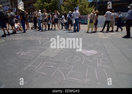 Sydney, Australia. 21st January, 2015. Refugee activists held rallies across Australia including one outside the Department of Immigration and Citizenship at 26 Lee Street, Sydney, organised by Refugee Action Coalition (RAC). The rallies were held in solidarity with the Manus Island hunger strike and the Iranian hunger striker in Darwin. Pictured are messages written in chalk by the protesters on George Street near Central Station. Credit: Copyright Credit:  2015 Richard Milnes / Alamy Live News. Stock Photo