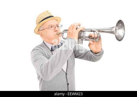 Senior gentleman playing a trumpet isolated on white background Stock Photo