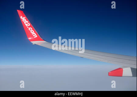 The wing of a Jet2 Boeing 737-800 during flight Stock Photo