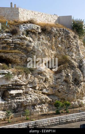 Rock with the shape of a skull near the Garden Tomb in Jerusalem. Pilgrims believe that this could be the rock Golgotha. Stock Photo