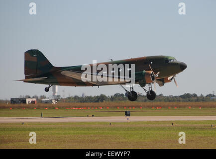 Old propeller airplane taking off from an airfield DC-3 Stock Photo