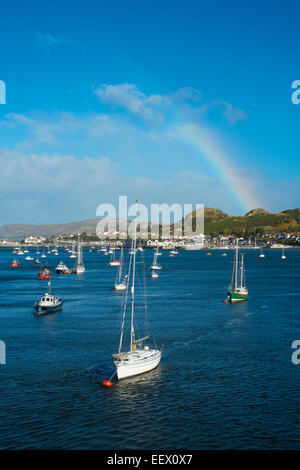 A rainbow over Conwy Bay looking at Deganwy, North Wales, UK Stock Photo