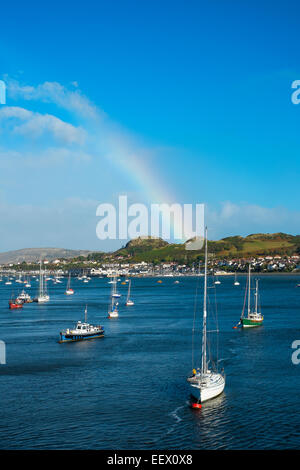 A rainbow over Conwy Bay looking at Deganwy, North Wales, UK Stock Photo