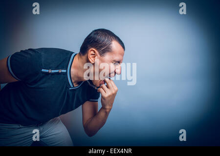 the man of European appearance brunet causes vomiting putting hi Stock Photo