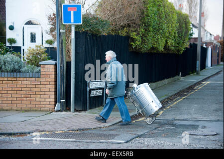 Strange man Walking Metal Dustbin Trash Can Funny Stock Photo