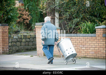 Strange man Walking Metal Dustbin Trash Can Funny Stock Photo