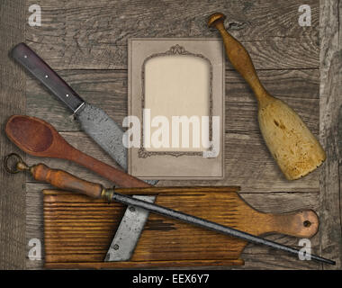 vintage kitchen utensils over wooden board, blank card for your text Stock Photo