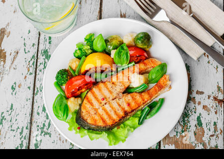 steak grilled salmon with vegetables on a plate Stock Photo