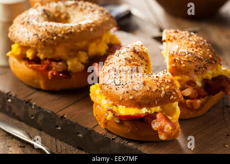 Hearty Breakfast Sandwich on a Bagel with Egg Bacon and Cheese Stock Photo