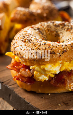 Hearty Breakfast Sandwich on a Bagel with Egg Bacon and Cheese Stock Photo