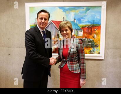 Edinburgh, Britain. 22nd Jan, 2015. British Prime Minister David Cameron (L) shakes hands with Scottish First Minister Nicola Sturgeon at the Holyrood Scottish parliament in Edinburgh, Britain, Jan. 22, 2015. British Prime Minister David Cameron on Thursday published plans giving the Scottish parliament new devolved powers. The new powers will give Scotland the power to set income tax rates and tax bands, but not to alter the threshold above which tax is paid. Credit:  Press Association/Xinhua/Alamy Live News Stock Photo