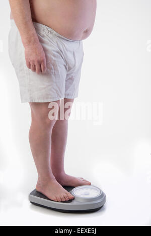 Professional weight scale and Obese male Stock Photo