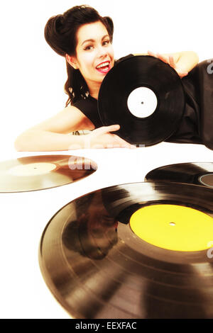 Happy girl retro woman with vintage phonography analogue vinyl records music lover Stock Photo