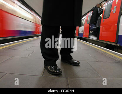 commuters on London Underground tube network northern line station Clapham Common during rush hour Stock Photo