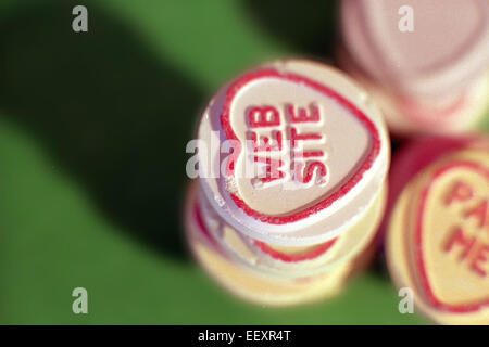 Web Site on Close-up of Lovehearts (Love Hearts) candy sweets, produced by Swizzels Matlow confectionery Stock Photo
