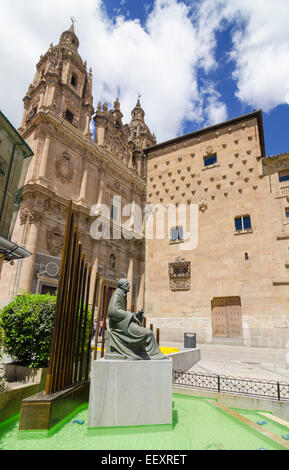 Monument to Francisco de Salinas in front of the Casa de las Conchas and  La Clerecia, Salamanca, Castile and Leon, Spain Stock Photo