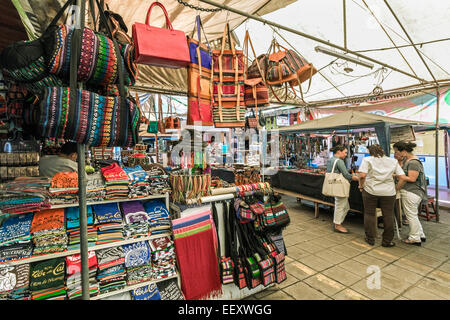 Bags, T shirts & souvenirs on sale in the famous Mercado Artesanias covered market, popular with tourists; Masaya, Nicaragua Stock Photo