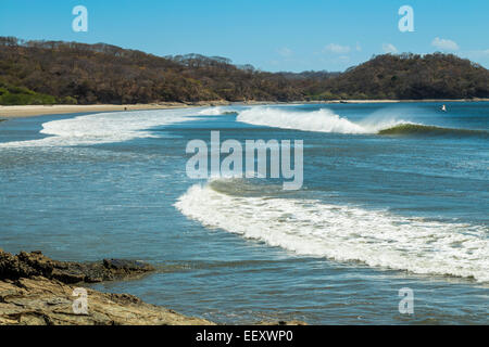 Surf wave at beautiful Playa El Coco beach south of San Juan del Sur; Playa El Coco, San Juan del Sur, Rivas Province, Nicaragua Stock Photo