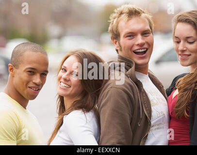Two couples posing together outdoors Stock Photo