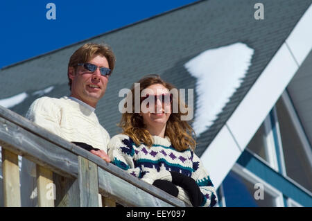 Couple on ski hill Stock Photo