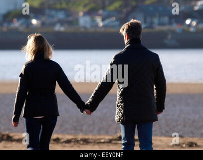 Middle aged couple holding hands, Devon, UK Stock Photo