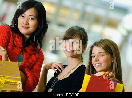 Three friends at a mall Stock Photo
