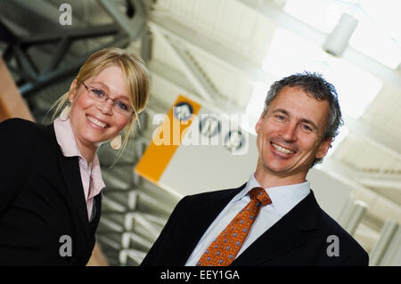Two business people in an airport Stock Photo