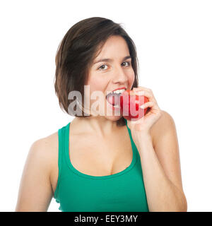 Beautiful young woman eating a red apple, isolated on white Stock Photo