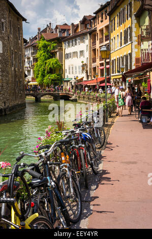 Bicycles line the river in Annecy, France old town Stock Photo