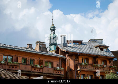 Chalets and church spire in the center of Megeve, Haute-Savoie, France, Europe in the French Alps in summer Stock Photo